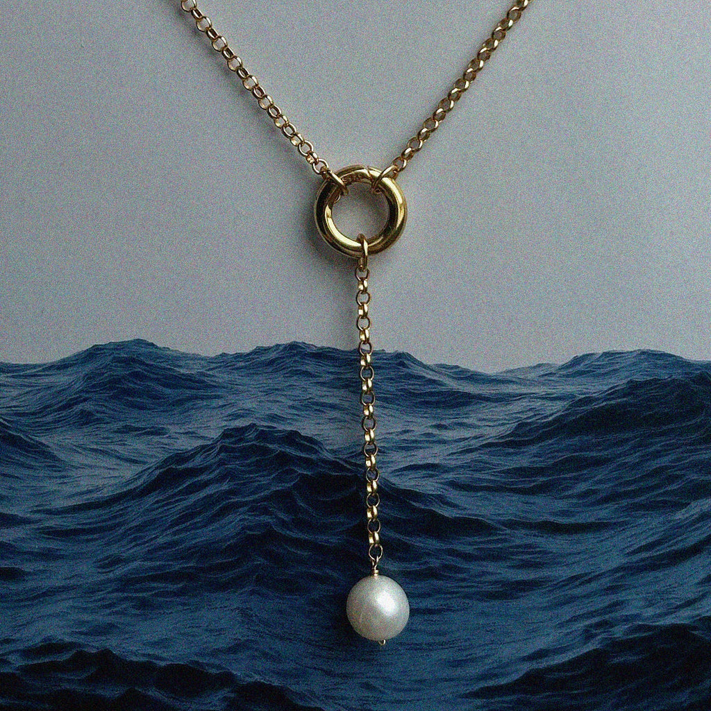 Aura Pearl Lariat Necklace - Photographed over a blue ocean background | Token & Pearl