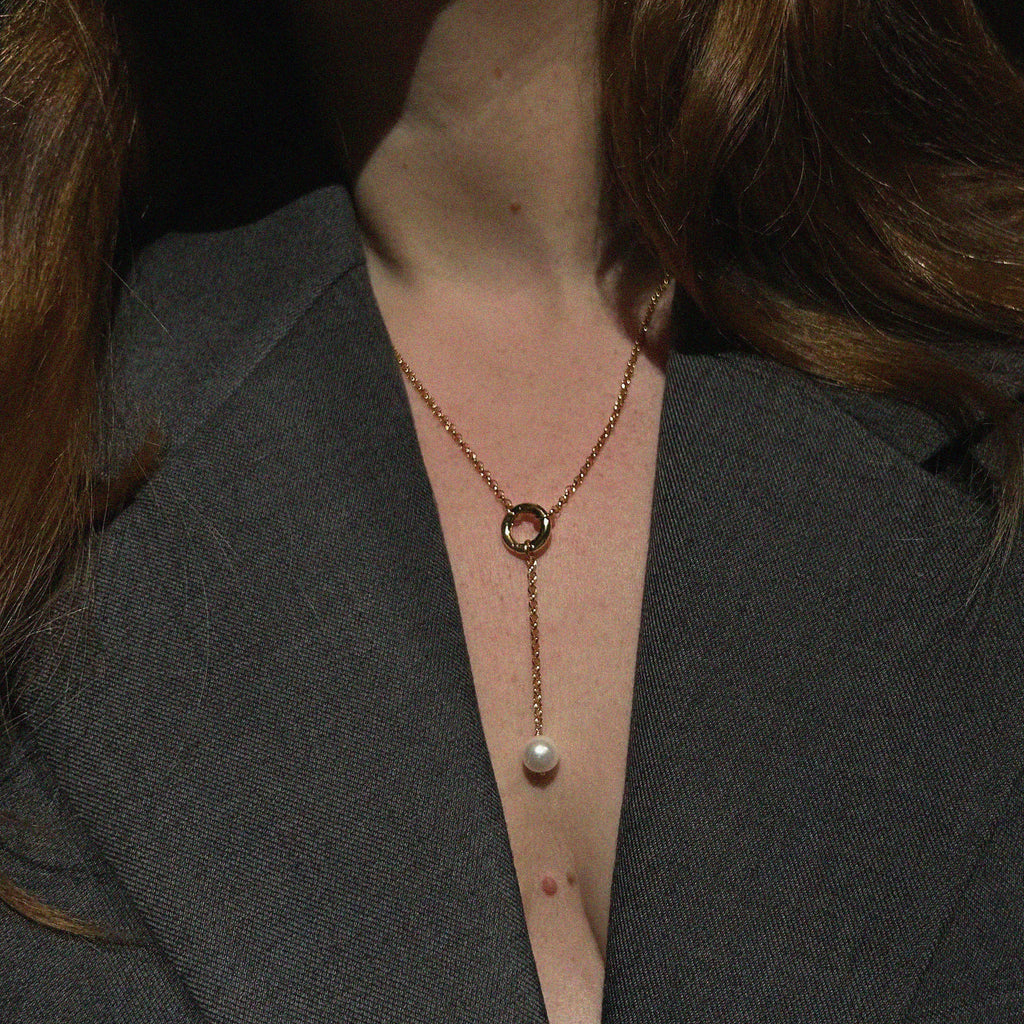 Aura Pearl Lariat Necklace - worn on model showing lariat drop length, gold ring detail, and freshwater pearl pendant | Token & Pearl