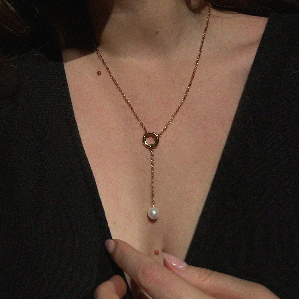 Aura Pearl Lariat Necklace - worn on model showing lariat drop length, gold ring detail, and freshwater pearl pendant | Token & Pearl