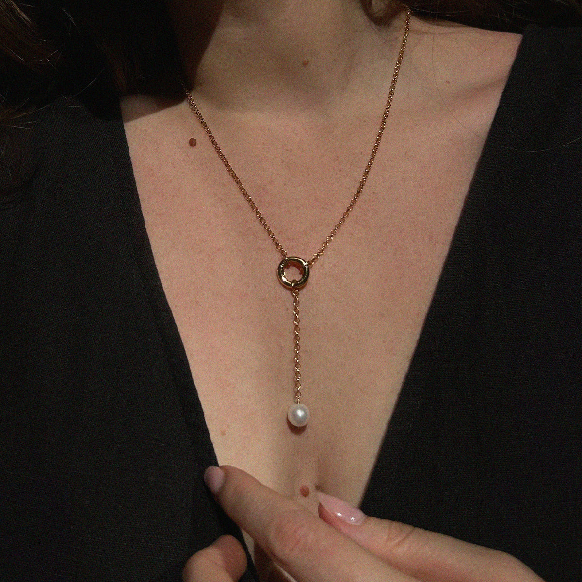Aura Pearl Lariat Necklace - worn on model showing lariat drop length, gold ring detail, and freshwater pearl pendant | Token & Pearl
