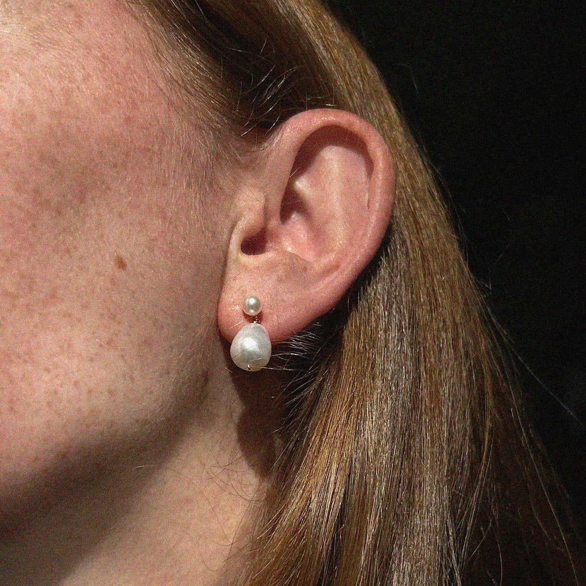 Alba Baroque Pearl Drop Earrings - on-model close-up view showing pearl stud fitting and organic baroque pearl drop | Token & Pearl