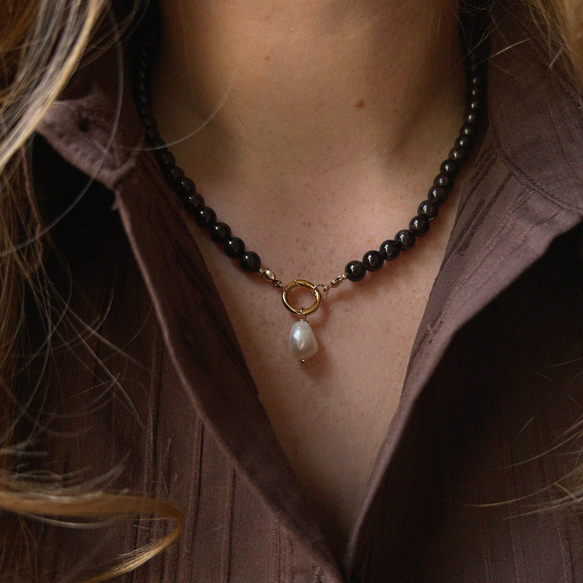 Garnet Pearl Drop Necklace - worn on model with brown collared shirt showing necklace drop length and fit | Token & Pearl