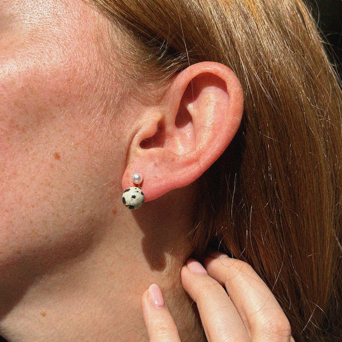 Dalmatian Jasper Pearl Stud Earrings - worn on model ear to show scale, fit, and styling details | Token & Pearl